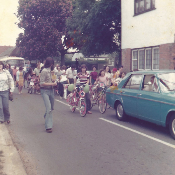 Blue car, belonging to Herbie Goddard, in procession.  