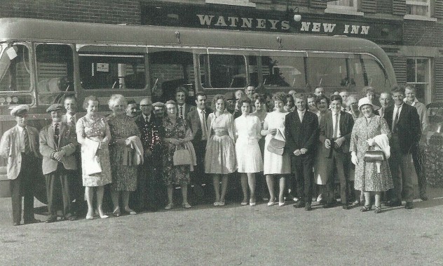 Group by bus outside New Inn