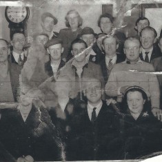 Group in pub with grandfather clock