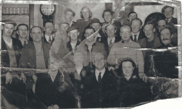Group in pub with grandfather clock