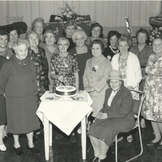 WI with cake. Back row, Ivy Cook, Shirley Kitcher, Mrs Bray, Nurse Day, Eileen Atkinson, Loreie Wilmot-Smith. 2nd row Audrey Street, Mrs Clitheroe, Mrs Aislewood, Rachel Mackinlay, Lettice Ross, Beryl Knight, Mrs Kille, Iris Porter. Front, Clarrie Fisher, Marion Lambert, Phyllis White, Dorrie Fisher