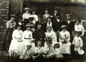 Information from Denise Moody: They both came from large families but no one has a clue who the other people are in the photo except Granny and Grandad Bone, he is in his army uniform and of course Granny in her wedding dress plus both sets of parents - Grandad Bones behind him with his Mum to the left and his Dad beside her further to the left. Granny Bone's parents are directly behind the bride and groom. 