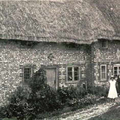Bottle Ale Cottage Couple outside Bottle Ale Coattages
