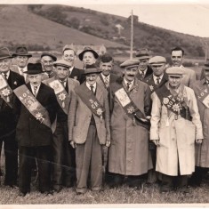 East Meon Court O A F 001 C 1950, Court of Meon Valley Ancient Order of Foresters, George, (Shaver), Cook, (my Fathers Brother), is front row with the lighter coloured Coat. My father, Jack Cook, is looking over his brothers right shoulder. Extreme right, Jack Appleby. Back row in front of School, Fred Gibbs and Jack Porter. Herbie Goddard, back row to the left.