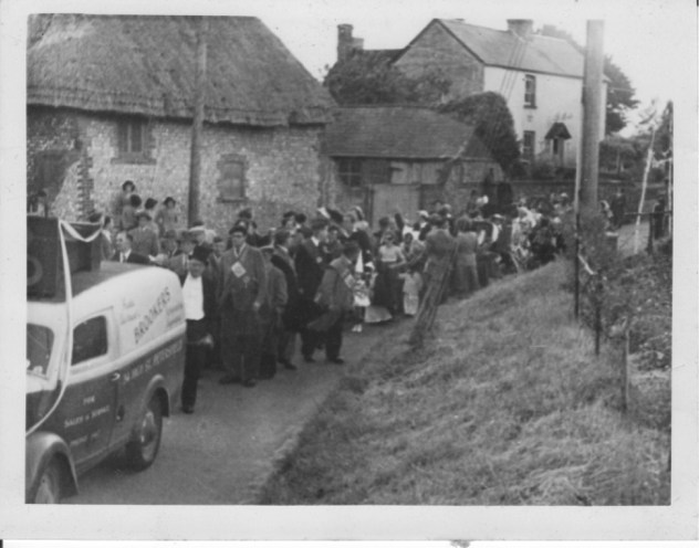 Coronation procession marches past Riverside, 1953. Lodge of Ancient Order of Foresters, Jack Pollard leading, Stuart Pollard on donkey, front row Hack Appleby, Herbie Goddard, Fred Gibbs. Jack Cook near back, wearing cap.