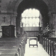 Black and white image of the nave, showing the East window. Date unknown but post 1921.