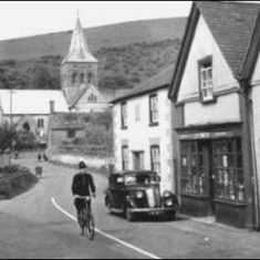 Cycling past Post Office in Church Street