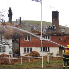 Firefighters and appliances after the first fire at Brook and Hockley cottages, March 2009.