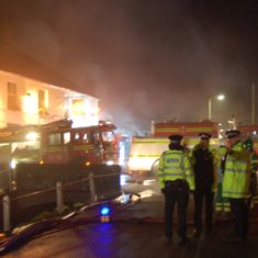 Fire at Brook & Hockley Cottages 2009treet Firefighters and appliances at the first fire at Brook and Hockley cottages, March 2009.