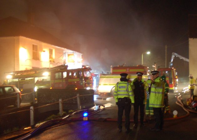 Firefighters and appliances at the first fire at Brook and Hockley cottages, March 2009.