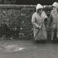 Flooding outside Frogmore Cottage George (last thatcher in East Meon) & Jean Samways outside Frogmore Cottage