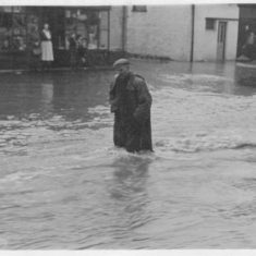 Man in flooded high street Man in flooded high street. From collection at Ye Olde George.