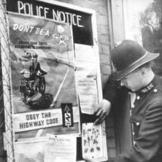 Outside Police Station with posters