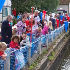 Spectators along river