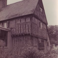 Tudor House with bush and shop Tudor House from north with back of shop.