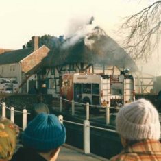 February 1996, villagers help Commander Page evacuate his house.