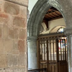 Wall painting and screen beyond Faded medieval wall pointing of angels or saints of which only the haloes can be seen today. | Richard Gaisford