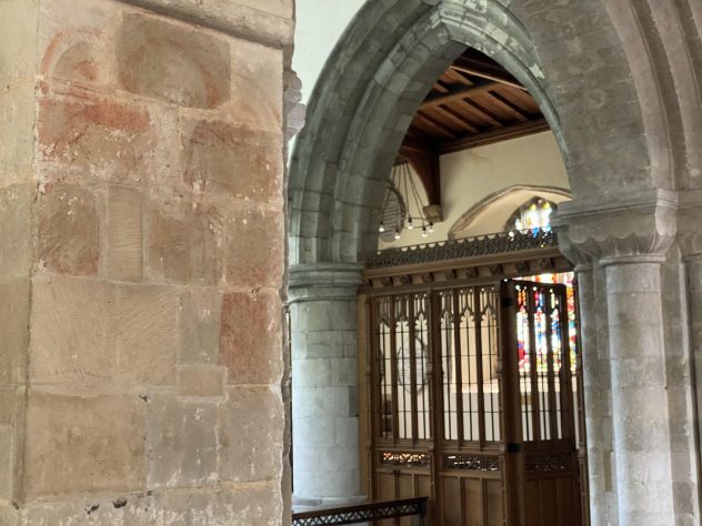 Faded medieval wall pointing of angels or saints of which only the haloes can be seen today. | Richard Gaisford
