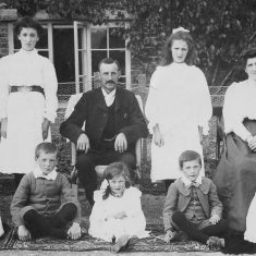 The Atkinson family in front of South Farm. Centre, George Atkinson. Left to right, back row, Hilda (Wren), Nellie (Hoskings) middle, Ethel (Hobbs), Mary Wilson; front, George, Millie, Joseph, Elizabeth. 