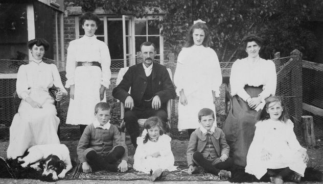 The Atkinson family in front of South Farm. Centre, George Atkinson. Left to right, back row, Hilda (Wren), Nellie (Hoskings) middle, Ethel (Hobbs), Mary Wilson; front, George, Millie, Joseph, Elizabeth. 