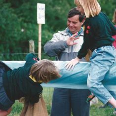 Girl falling off slippery beam