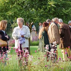 Sylvia Brindley and visitors in Bottle Cottage garden