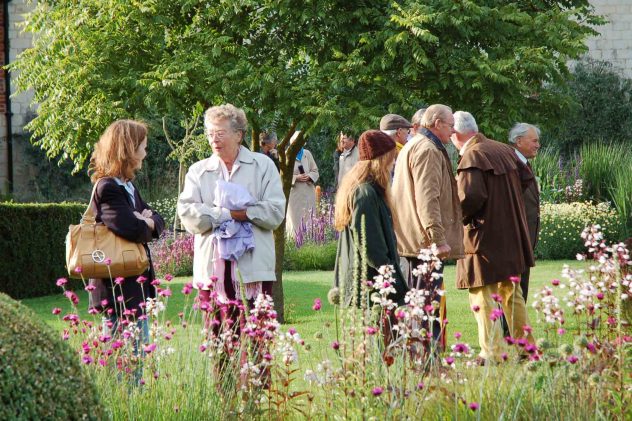 Sylvia Brindley and visitors in Bottle Cottage garden